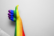 Gay pride LGBT colors paint thumbs up gesture hand