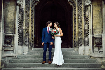 Wall Mural - Newly wed couple on the church steps