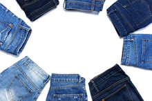 Frame Of Different Blue Jeans Isolated On White Background Top View Flat Lay. Detail Of Nice Blue Jeans. Jeans Texture Or Denim Background. Trend Clothing. Beauty And Fashion, Clothing Concept.