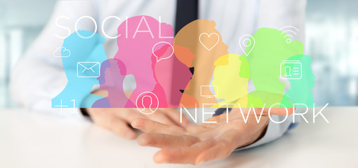Poster - Businessman holding a colorfull social network teamwork with icon 3d rendering