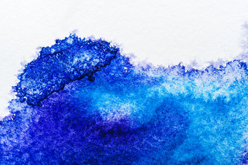 Poster - top view of blue watercolor spill on white background