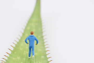 miniature people running