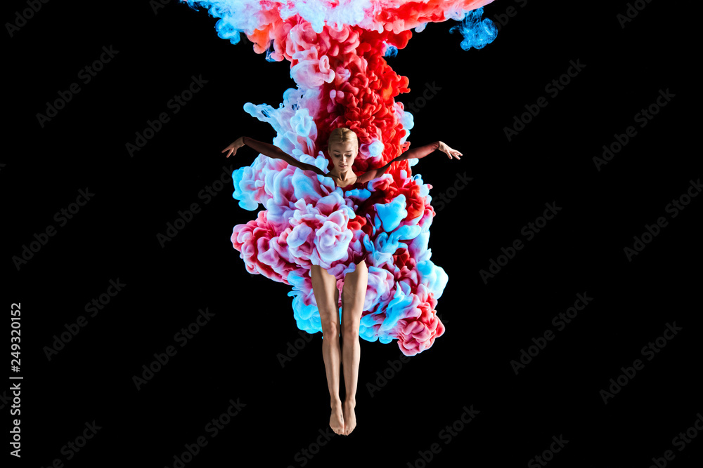 Modern art collage. Concept ballerina with colorful smoke. Abstract formed by color dissolving in water on black background - obrazy, fototapety, plakaty 