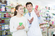 © JackF - specialist  helping client choose medicine in pharmacy