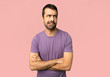 © luismolinero - Handsome man with confuse face expression while bites lip on isolated pink background