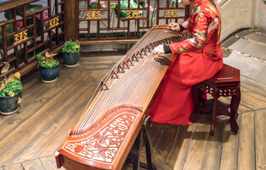 Women are playing zither, Chinese instruments