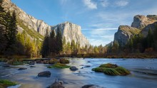 Merced River In Yosemite National Park. El Capitan And Half Dome Are In The Background.