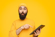 © kegfire - Surprised man pointing at tablet