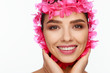 © Andriy Goncharenko - Portrait of an energetic laughing beautiful woman with a pink wreath on her head