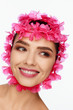 © Andriy Goncharenko - Portrait of an energetic laughing beautiful woman with a pink wreath on her head