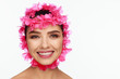 © Andriy Goncharenko - Portrait of an energetic laughing beautiful woman with a pink wreath on her head