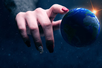 Poster - Woman touching planet with finger. Nebula dust in infinite space. Mixed media.