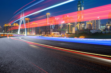 Poster - abstract image of blur motion of cars on the city road at night，Modern urban architecture in Chongqing, China