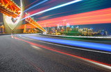 Fototapeta  - abstract image of blur motion of cars on the city road at night，Modern urban architecture in Chongqing, China