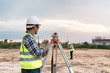 © kokliang1981 - Surveyor equipment. Surveyor’s telescope at construction site or Surveying for making contour plans are a graphical representation of the lay of the land before startup construction work