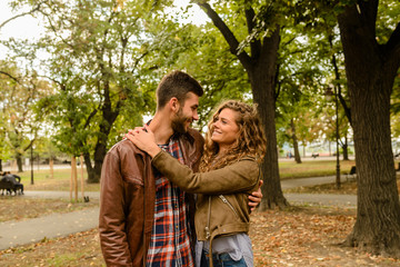 modern couple enjoying the time in the city park