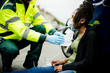© Rawpixel.com - Male paramedic putting on an oxygen mask to an injured woman on a road
