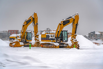 Canvas Print - Snowy excavators during winter in Daybreak Utah