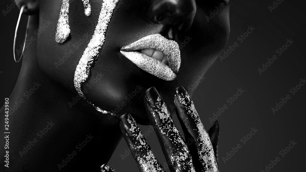Young woman face with art fashion makeup. An amazing model with creative makeup. Black and white closeup portrait - obrazy, fototapety, plakaty 