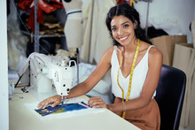 Seamstress Working On Sewing Machine