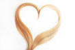 © Ulia Koltyrina - strand of blond hair isolated on white. Curls of hair in the shape of a heart
