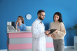 © Pixel-Shot - Doctor consulting patient in private clinic