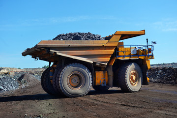Wall Mural - Large quarry dump truck. Loading the rock in the dumper. Loading coal into body work truck