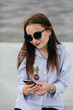 © andriyyavor - Woman using smart phone mobile