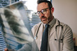 © Jacob Lund - Doctor looking at chest x ray of his patient