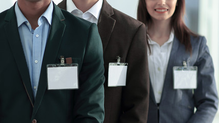 group of young business people with blank badges.