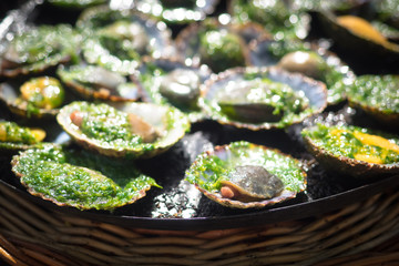 grilled limpets with green mojo, typical avocado in Lanzarote