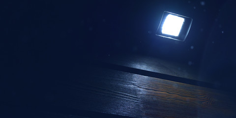 Poster - LED lamp on a wooden wall, light in the dark