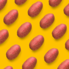 Wall Mural - Potato on a colored background. Pattern of potato. Natural red potato