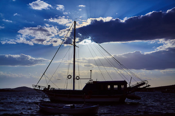 Wall Mural - Sailing ship on sea view on sunset with beautiful sky