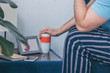 © LIGHTFIELD STUDIOS - cropped view of man holding funeral urn near picture of woman in frame and wedding rings on table
