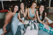 © Yakobchuk Olena - Outgoing ladies watching funny cinema at home