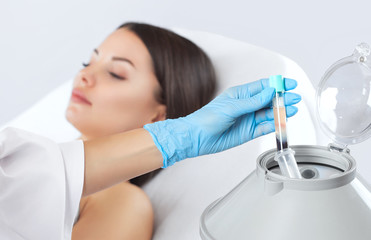 the blood tube is removed from the medical centrifuge for plasma lifting. prp procedure.