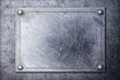Grunge metal texture with nameplate on rivets