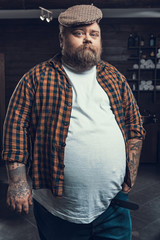 Poster - Attractive man looking in camera and standing in hair cutting salon