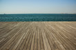 © Artem Kniaz - summer sea waterfront shoreline with deck floor perspective foreground foreshortening wooden surface and horizontal panoramic, copy space