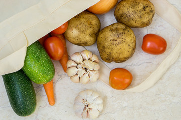 Organic farm vegetables in reusable fabric bag