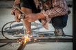 Men work welding unsafe