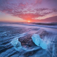 Wall Mural - beautiful sunset over famous diamond beach, iceland. this sand lava beach is full of many giant ice 
