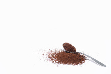 Scoop with ground coffee on white background