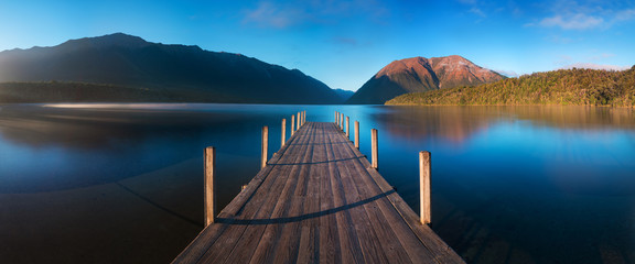 Wall Mural - romantic wharf on lake rotoiti, view overlooking misty saint arnaud ridge, all part of nelson lakes 