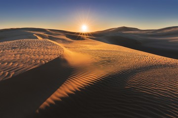 sunset view of the tepaki giant sand dunes at cape reinga (te rerenga wairua), the north westernmost