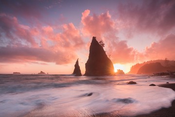 Wall Mural - Coastline with sea stacks in sunset time with red and purple light. Rialto Beach in Olympic National Park, Olympic Peninsula near Seattle, Olympia, Port Angeles. Washington. United States of America