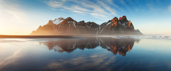 Wall Mural - black sand beach on the stokksnes headland on southeastern icelandic coast with vestrahorn. colorful