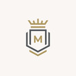 Heraldic Letter M monogram. Elegant minimal logo design. Letter M + Crown + Book + Shield.
