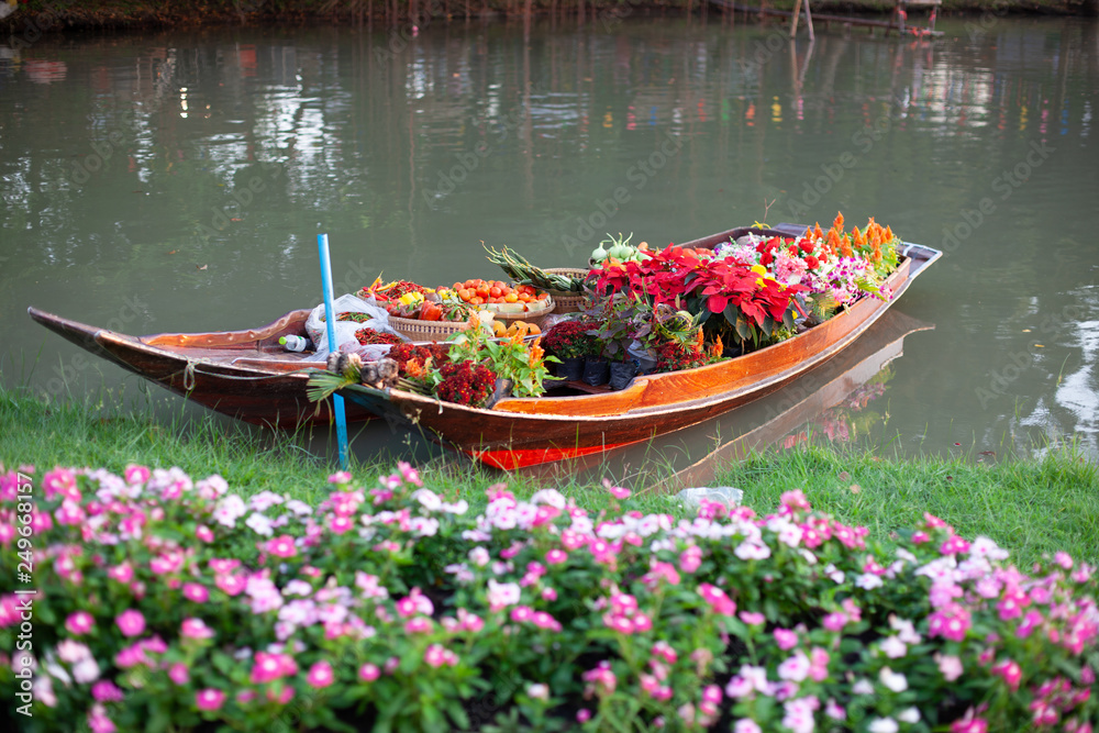 Flower boat in the garden. Stock Photo | Adobe Stock
